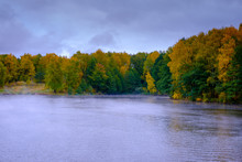 The River Flows Through The Autumn Forest.