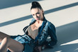 © LIGHTFIELD STUDIOS - stylish young woman posing in trendy denim clothes
