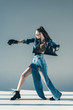© LIGHTFIELD STUDIOS - girl in denim clothes, sunglasses and boxing gloves posing for fashion shoot