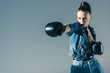 © LIGHTFIELD STUDIOS - selective focus of boxing girl in denim clothes, isolated on grey