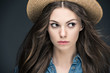 © LIGHTFIELD STUDIOS - portrait of attractive girl with long hair in straw hat, isolated on grey