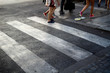 © Adam - Zebra crossing, with 3 stripes and legs crossing, in Rome (Italy)