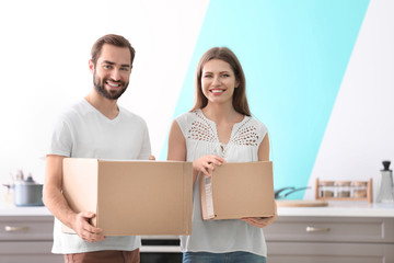 Poster - Young couple with boxes indoors. Moving day