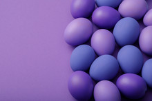 Purple Easter Eggs On A Paper Background With Space For Text