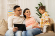 © Syda Productions - mother, father and baby with tablet pc at home