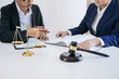 © Freedomz - Teamwork of business lawyer colleagues, consultation and conference of professional female lawyers working having at law firm in office. Concepts of law, Judge gavel with scales of justice