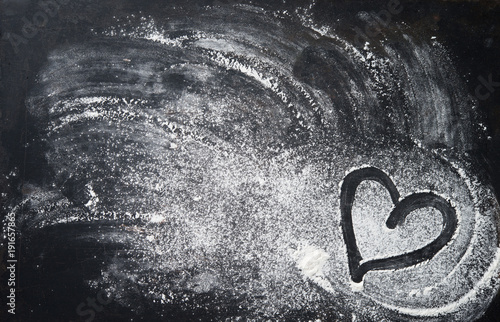 Cuadros en Lienzo Baking background with heart shape and flour on the dark table
