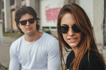 Girlfriend looking to the side while her boyfriend is behind