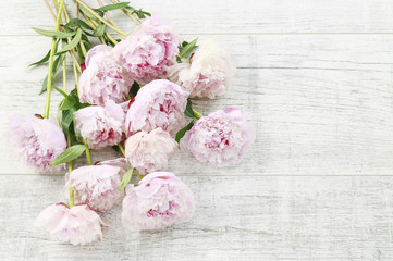 Canvas Print - Big bouquet of pink peonies on white wooden background