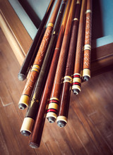 Billiard Sticks For Your Poster Or Cover Of Playing Club. Billiard Cues On Pool Table, Traditional Equipment For Snooker Game. Background For Your Concept Hobby And Leisures With Place For Lettering.