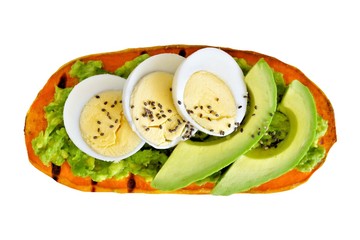 Wall Mural - Sweet potato toast with avocado, eggs and chia seeds. Isolated on a white background.