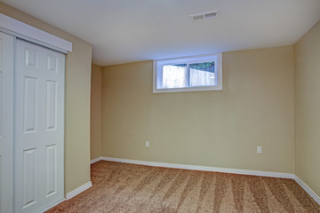 Empty room, sand beige walls, carpet floor in a luxury home.