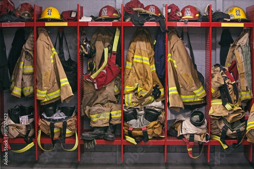 Firefighter gear helmet on a truck Poster Mural XXL