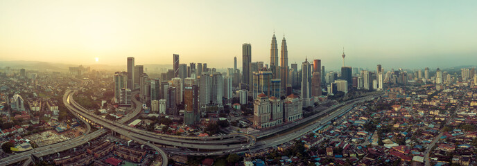 Wall Mural - Panorama aerial view in the middle of Kuala Lumpur cityscape skyline , early morning sunrise scene, Malaysia .