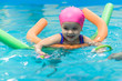 © Maksim - A little girl of European appearance floating in the pool on inflatable toy