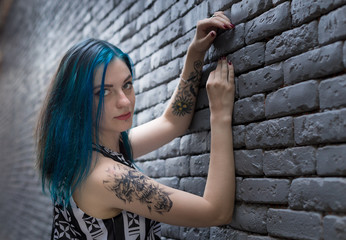 Wall Mural - blue haired goth girl walk in the city