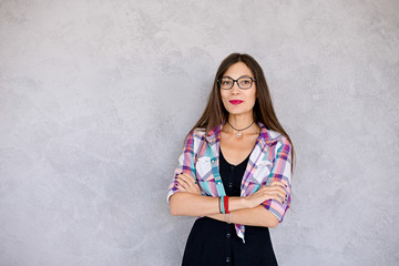 Wall Mural - Smiling woman wearing glasses studio shot