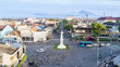 © Creativa Images - Tugu Yogyakarta with mount under blue sky