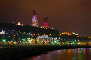 Wall Mural - Flamе towers and a city embankment on December evening. Baku, Azerbaijan