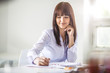 © Zdenek - Happy young businesswoman writing in diary at office