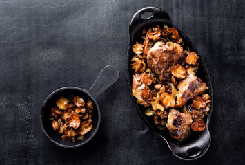 Wall Mural - meat baked with mushrooms and onions in cast iron dish