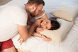 © dmitriisimakov - man wakes a woman in the morning
