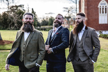 Smart Men With Beard And Moustache Wearing A Suit Near A Castle