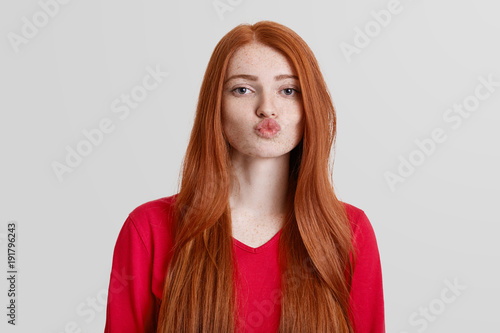 Adorable Red Haired Female With Freckled Skin Rounds Lips Going