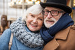 © Yakobchuk Olena - Portrait of joyful senior married couple hugging while relaxing outdoor