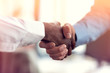 © FS-Stock - Closeup of White and Black shaking hands over a deal