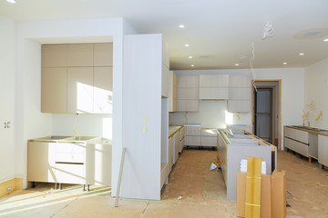 Wall Mural - installation of kitchen assembling shelf inside kitchen cabinet