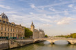 Color outdoor Paris cityscape photo of the bride Pont au Change over river Seine with a view towards the commercial court,conciergerie, french court of appeal on a bright sunny autumn day