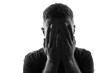 © Glebstock - Male person silhouette over white covering his face with hands