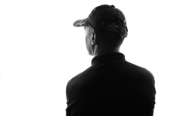 Male person silhouette,back lit over white