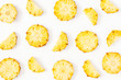 © Flaffy - Pineapples on white background. Pattern made of sliced pineapples. Flat lay, top view, copy space