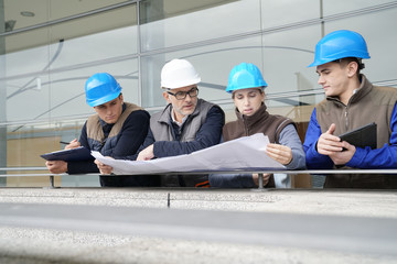 Wall Mural - Instructor with young people in engineering training