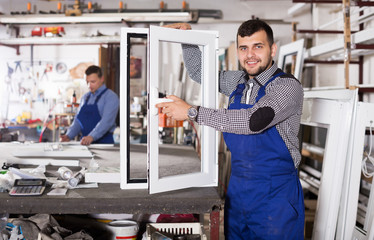 Wall Mural - Workman showing PVC manufacturing output