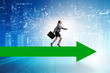 © Elnur - Businesswoman walking on arrow sign