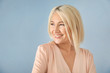 © Africa Studio - Portrait of smiling mature woman on color background