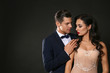 © Africa Studio - Sexy woman in underwear and businessman wearing suit on dark background