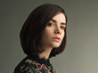 © Sergey Chumakov - close up studio portrait of young attractive brunette woman, gray background
