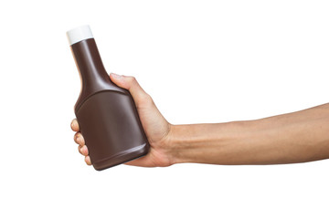 Wall Mural - Man hand holding brown bottle isolated on white background with clipping path.