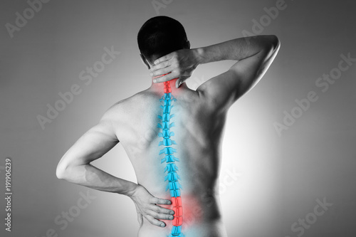 Fotografía Pain in the spine, a man with backache, injury in the human back and neck
