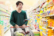 © torwaiphoto - Asian men are choosing to buy in the supermarket