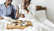 © Rawpixel.com - A couple having breakfast in bed