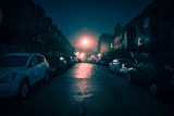 Fototapeta Uliczki - Dark wet city street with cars at night with fog.
