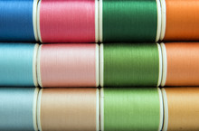 Colorful Sewing Threads Background Closeup