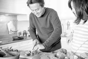 Canvas Print - Asian couple cooking in the kitchen