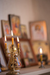 Wall Mural - candle against the background of orthodox icons