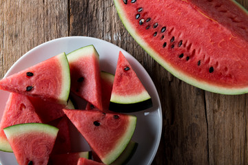 Wall Mural - Watermelon on wooden table background